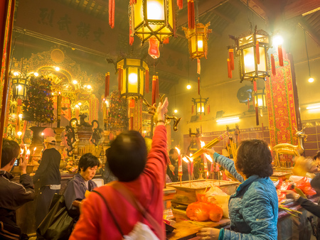 HONG KONG, CHINA - JANUARY 20 : Man Mo temple with full of incense smoke from respect people, landmark at central district of Hong Kong, China, on January 20, 2018.のeditorial素材