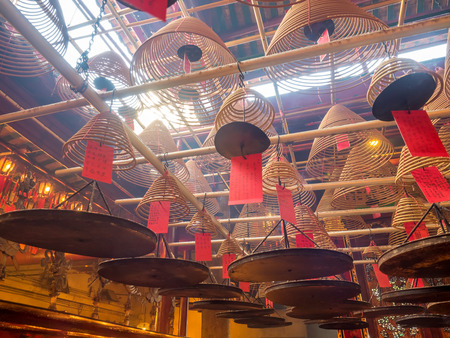 HONG KONG, CHINA - JANUARY 20 : Man Mo temple with full of incense smoke from respect people, landmark at central district of Hong Kong, China, on January 20, 2018.のeditorial素材