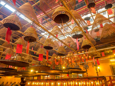 HONG KONG, CHINA - JANUARY 20 : Man Mo temple with full of incense smoke from respect people, landmark at central district of Hong Kong, China, on January 20, 2018.のeditorial素材