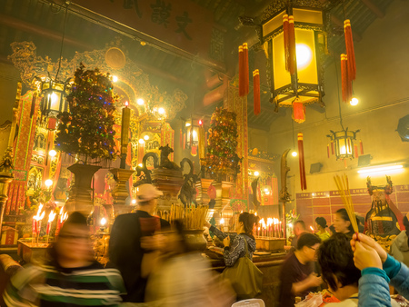 HONG KONG, CHINA - JANUARY 20 : Man Mo temple with full of incense smoke from respect people, landmark at central district of Hong Kong, China, on January 20, 2018.のeditorial素材