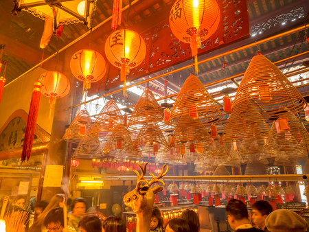 HONG KONG, CHINA - JANUARY 20 : Man Mo temple with full of incense smoke from respect people, landmark at central district of Hong Kong, China, on January 20, 2018.のeditorial素材