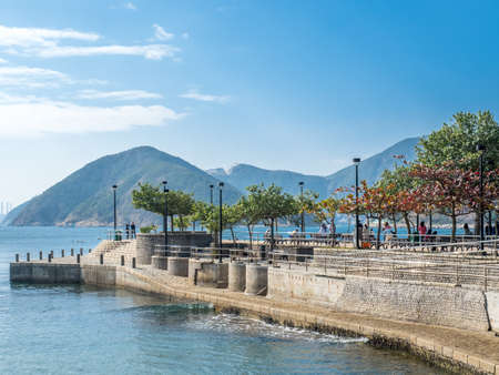 Coastline along Repulse bay at Kwun Yam shrine under blue sky, Hong Kong, Chinaの写真素材