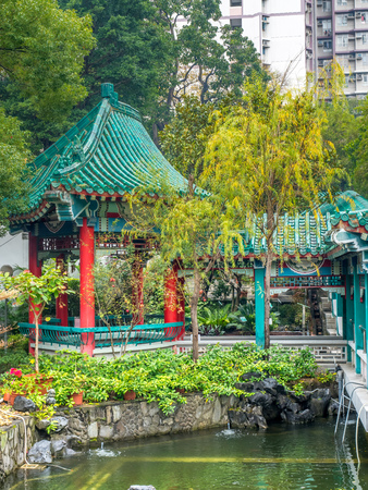 HONG KONG, CHINA - JANUARY 19 : Chinese style pavilion in Wong Tai Sin Temple under cloudy sky in Hong Kong, on January 19, 2018.のeditorial素材