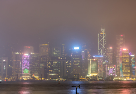 HONG KONG, CHINA - JANUARY 19 : Night light show with skyscraper buildings at Victoria harbor, Hong Kong, China, on January 19, 2018.のeditorial素材