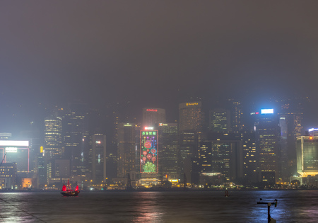 HONG KONG, CHINA - JANUARY 19 : Night light show with skyscraper buildings at Victoria harbor, Hong Kong, China, on January 19, 2018.のeditorial素材