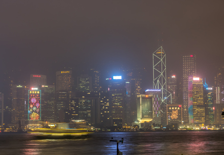 HONG KONG, CHINA - JANUARY 19 : Night light show with skyscraper buildings at Victoria harbor, Hong Kong, China, on January 19, 2018.のeditorial素材
