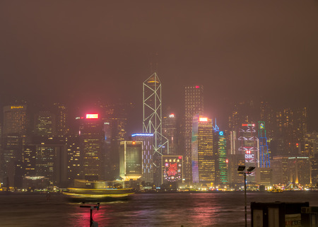 HONG KONG, CHINA - JANUARY 19 : Night light show with skyscraper buildings at Victoria harbor, Hong Kong, China, on January 19, 2018.のeditorial素材