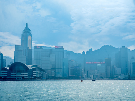 HONG KONG, CHINA - JANUARY 20 : Landmark skyscraper buildings at Victoria harbor with daylight mist, Hong Kong, China, on January 20, 2018.のeditorial素材