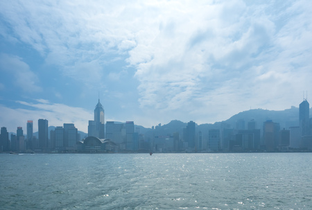 HONG KONG, CHINA - JANUARY 20 : Landmark skyscraper buildings at Victoria harbor with daylight mist, Hong Kong, China, on January 20, 2018.のeditorial素材