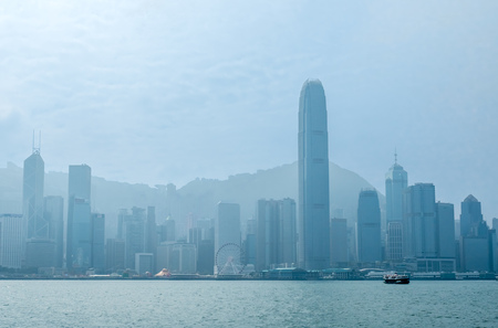 HONG KONG, CHINA - JANUARY 20 : Landmark skyscraper buildings at Victoria harbor with daylight mist, Hong Kong, China, on January 20, 2018.のeditorial素材