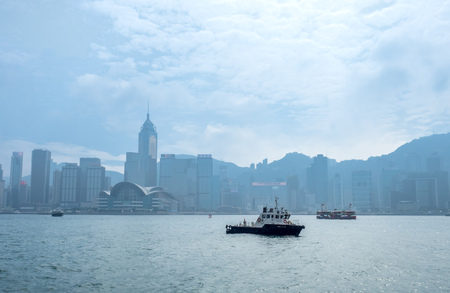 HONG KONG, CHINA - JANUARY 20 : Landmark skyscraper buildings at Victoria harbor with daylight mist, Hong Kong, China, on January 20, 2018.のeditorial素材