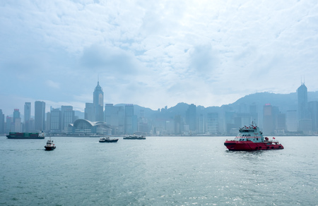 HONG KONG, CHINA - JANUARY 20 : Landmark skyscraper buildings at Victoria harbor with daylight mist, Hong Kong, China, on January 20, 2018.のeditorial素材