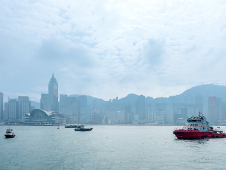 HONG KONG, CHINA - JANUARY 20 : Landmark skyscraper buildings at Victoria harbor with daylight mist, Hong Kong, China, on January 20, 2018.のeditorial素材
