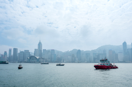 HONG KONG, CHINA - JANUARY 20 : Landmark skyscraper buildings at Victoria harbor with daylight mist, Hong Kong, China, on January 20, 2018.のeditorial素材
