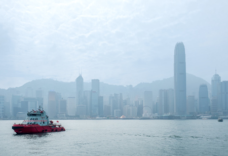 HONG KONG, CHINA - JANUARY 20 : Landmark skyscraper buildings at Victoria harbor with daylight mist, Hong Kong, China, on January 20, 2018.のeditorial素材