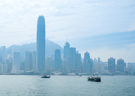HONG KONG, CHINA - JANUARY 20 : Landmark skyscraper buildings at Victoria harbor with daylight mist, Hong Kong, China, on January 20, 2018.のeditorial素材
