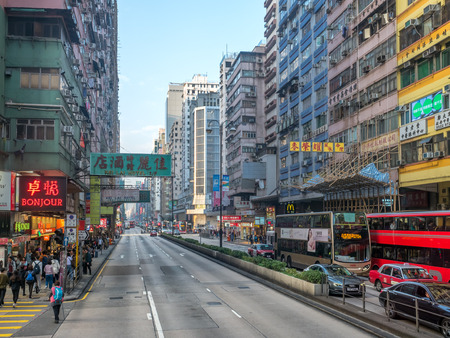 HONG KONG, CHINA - JANUARY 21 : Commercial buildings along busy street near Yau Ma Tei district at Hong Kong, China, on January 21, 2018.のeditorial素材