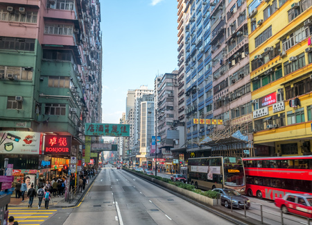 HONG KONG, CHINA - JANUARY 21 : Commercial buildings along busy street near Yau Ma Tei district at Hong Kong, China, on January 21, 2018.のeditorial素材