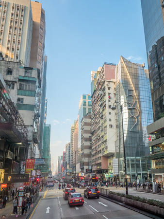 HONG KONG, CHINA - JANUARY 21 : Commercial buildings along busy street near Yau Ma Tei district at Hong Kong, China, on January 21, 2018.のeditorial素材