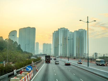 HONG KONG, CHINA - JANUARY 21 : Express way and large avenue in Hong Kong, under sunset sky, on January 21, 2018.のeditorial素材