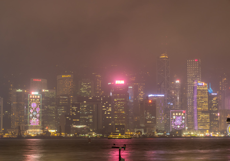 HONG KONG, CHINA - JANUARY 19 : Night light show with skyscraper buildings at Victoria harbor, Hong Kong, China, on January 19, 2018.のeditorial素材