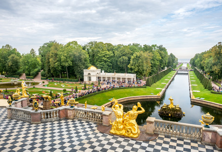 PETERHOF, RUSSIA - SEPTEMBER 1 : Fountains in famous garden around Grand cascade palace of Peterhof in summer season under cloudy sky in Russia, on September 1, 2018.のeditorial素材