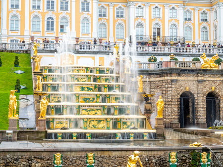 PETERHOF, RUSSIA - SEPTEMBER 1 : View of Grand Cascade palace and surrounding fountains in summer season of Peterhof palace in Russia under cloudy sky, on September 1 2018.のeditorial素材