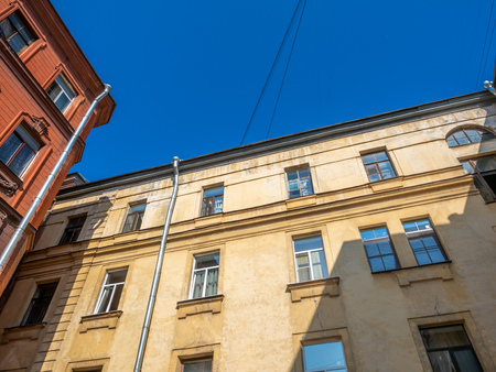 Exterior architecture of living buildings in Saint Petersburg under clear blue sky, Russiaの写真素材
