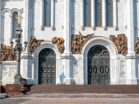 Door arch decoration with angel sculptures at Cathedral of Christ the Saviour, landmark of Moscow, Russia, under blue sky in summer seasonのeditorial素材