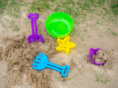 Sand toy set on beach, shovel, starfish, bowl, fun play with childrenの写真素材