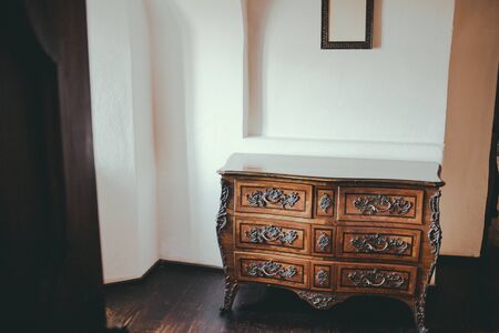 Old royal image of vintage retro room furniture . Brown luxury wardrobe cupboard closet , sideboard blank on white wall background.の写真素材