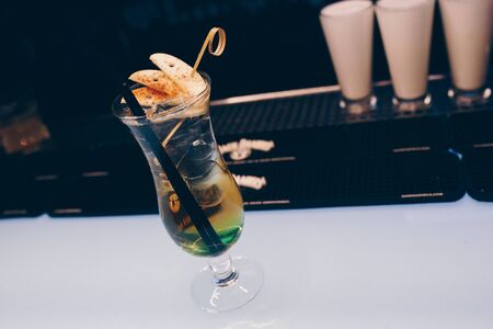 Sweet Famous white with caramels decoration fruit  Author inspired Cocktail Bar Drink on bar counter...
