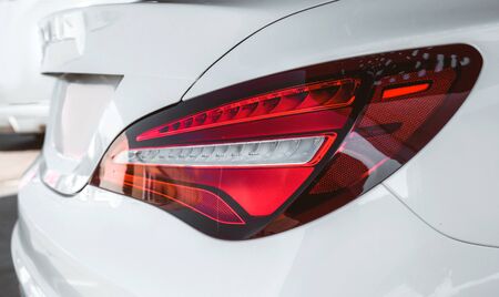 Car detailing : Glass coating Closeup modern glossy shine modern luxury white Back lights headlight...