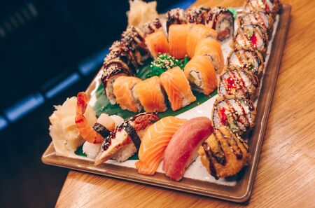 Large set of Delicious sushi rolls view from above Flat Lay . A lot assortment Philadelphia roll Dishes from Japanese raw fish  in one plate in traditional restaurant. Japan food menu serviceの写真素材
