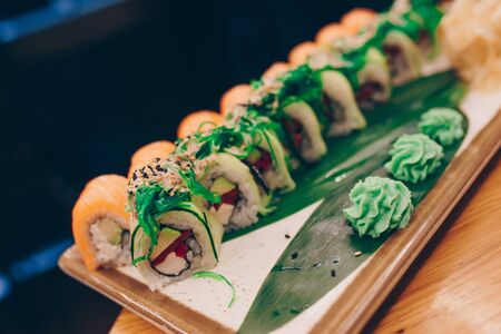 Large set of Sushi Rolls Warm Ebi Sake Unagi Spring. A lot assortment Philadelphia roll Dishes from Japanese raw fish  in one plate in traditional restaurant. Japan food menu serviceの写真素材