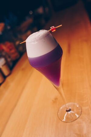 Sweet Famous white with caramels decoration slice  Author inspired Cocktail Drink - on bar counter . Close-up Top view . Copy paste space for design people and luxury service barman in nightclubの写真素材