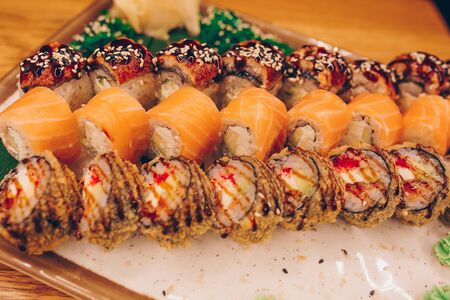 Large set of Sushi Rolls Warm Ebi Sake Unagi Spring. Assortment Philadelphia roll Dishes from Japanese raw fish in one plate in luxury traditional restaurant. Japan food menu serviceの写真素材
