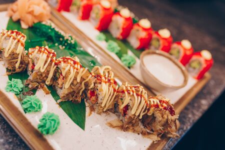Large set of Sushi Rolls Warm Ebi Sake Unagi Spring. Assortment Philadelphia roll Dishes from Japanese raw fish in one plate in luxury traditional restaurant. Japan food menu serviceの写真素材