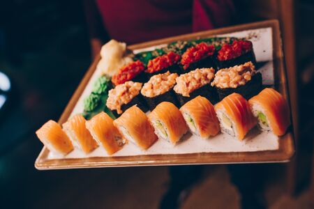 Large set of Sushi Rolls Warm Ebi Sake Unagi Spring. Assortment Philadelphia roll Dishes from Japanese raw fish in one plate in luxury traditional restaurant. Japan food menu serviceの写真素材