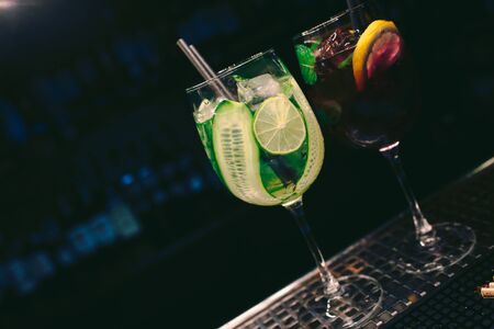 Fresh Healthy Juice summer ice cold modern Cocktail with Fruit decoration slice Author Drink - on bar counter . Close-up Top view . Copy paste space design barman people and luxury nightclub の写真素材