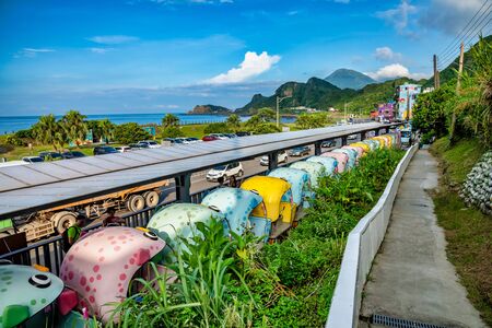 Four-wheeled bicycles on abandoned train tracks . It's a popular place to relax, in Badouzi, Keelung, Taiwan. August 21, 2019のeditorial素材