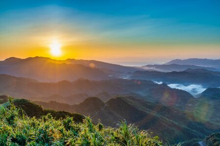 Beautiful sunrise scenery of mountains in New Taipei City, Taiwanの写真素材