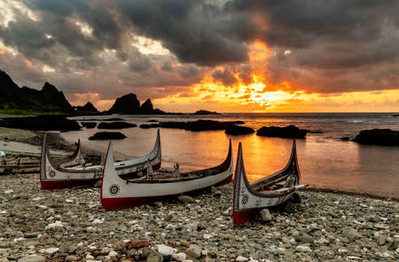Traditional boats at sunrise. The boats belong to an ethnic group there.In Lanyu (Orchid Island), Taitung,Taiwanの写真素材