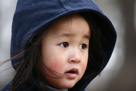  close up of child with winter hatの写真素材