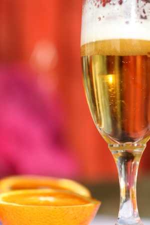 close up picture of a cocktail glass with orange colorの写真素材