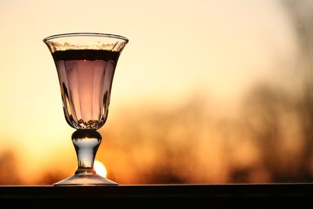 wine glass with orange background (sunset)の写真素材