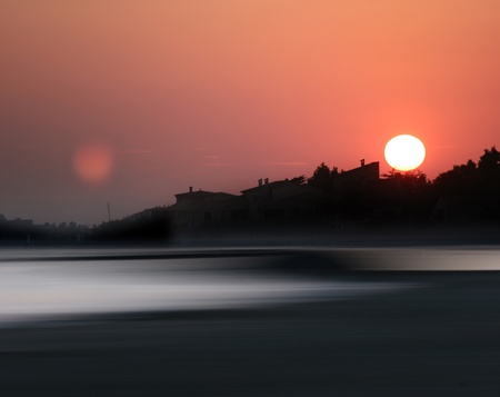 At the sea in south of France, silhouette of the town at sunset の写真素材