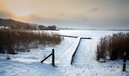 winter sceneries in denmark , a frozen lake a lake in denmark in winterの写真素材