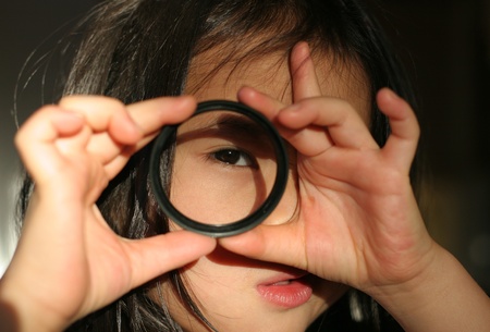 child playing with  photo lensesの写真素材