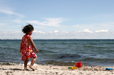 child playing and jumping a summer day at the beach
in denmark
の写真素材